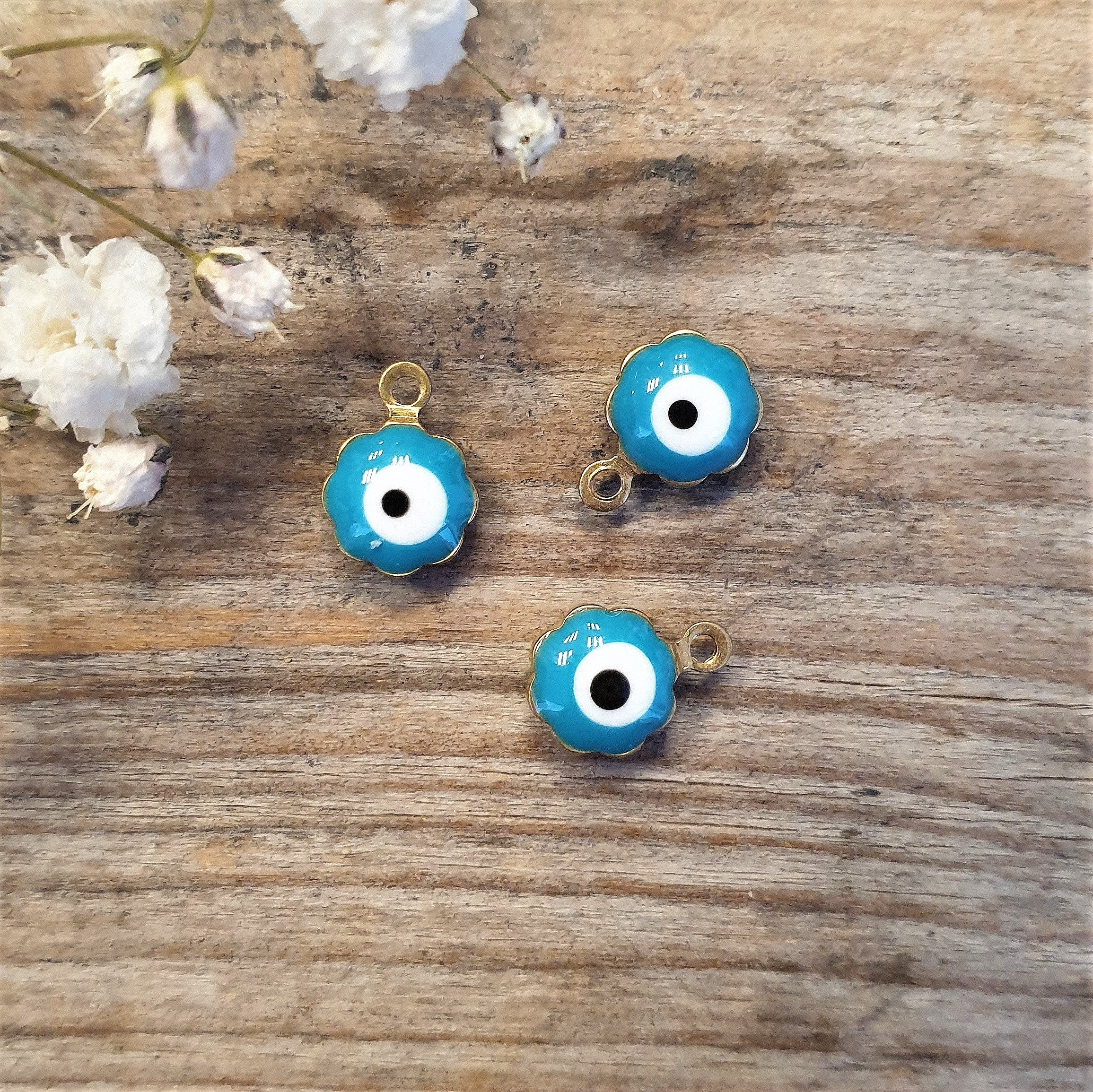 Enamel bedel - evil eye blauw goud