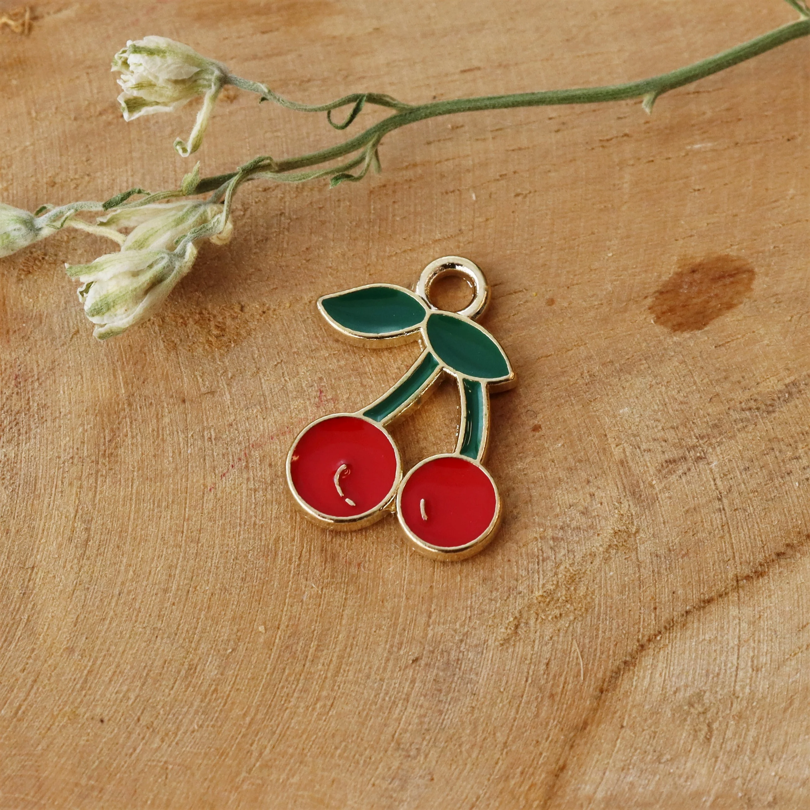 Enamel bedel - kers goud