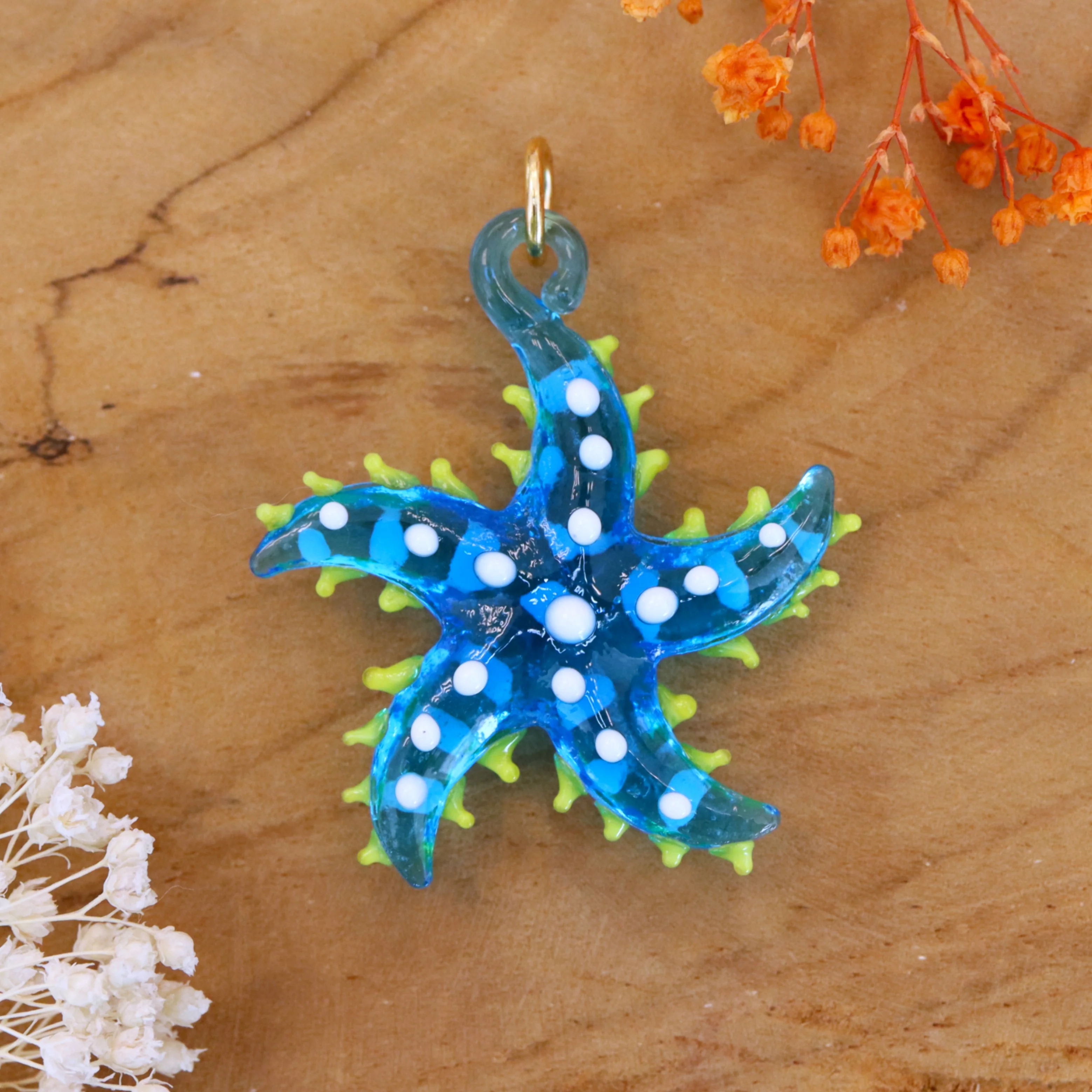 Kettingbedel - glazen zeester blauw