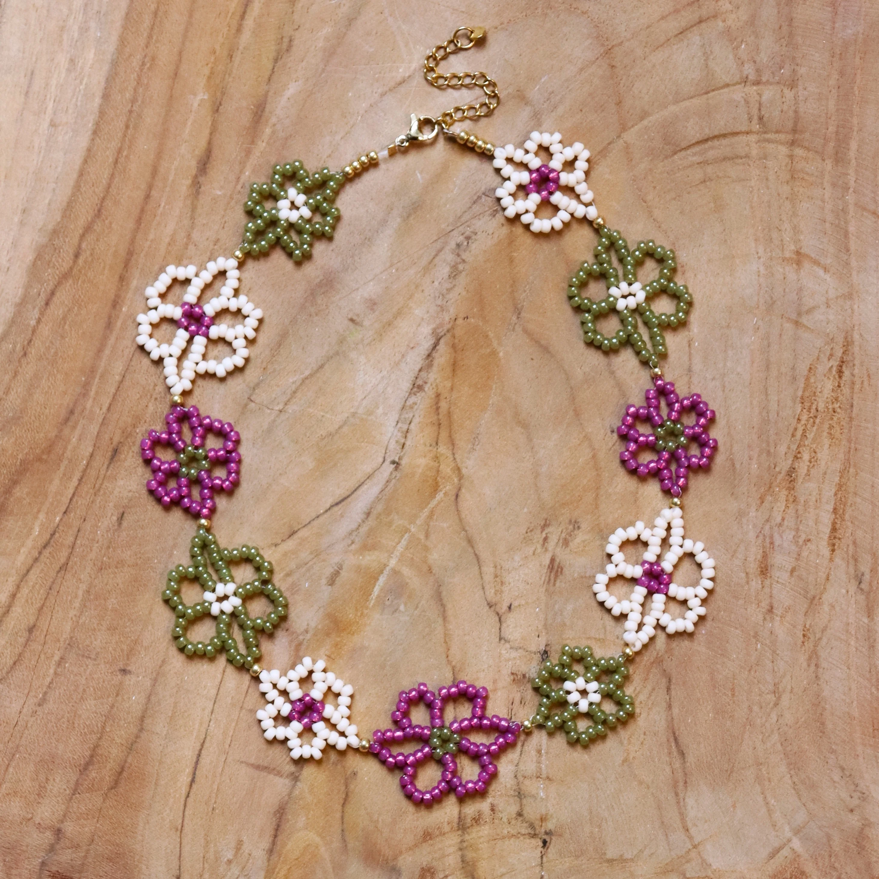 Kralenketting met bloemen - goud