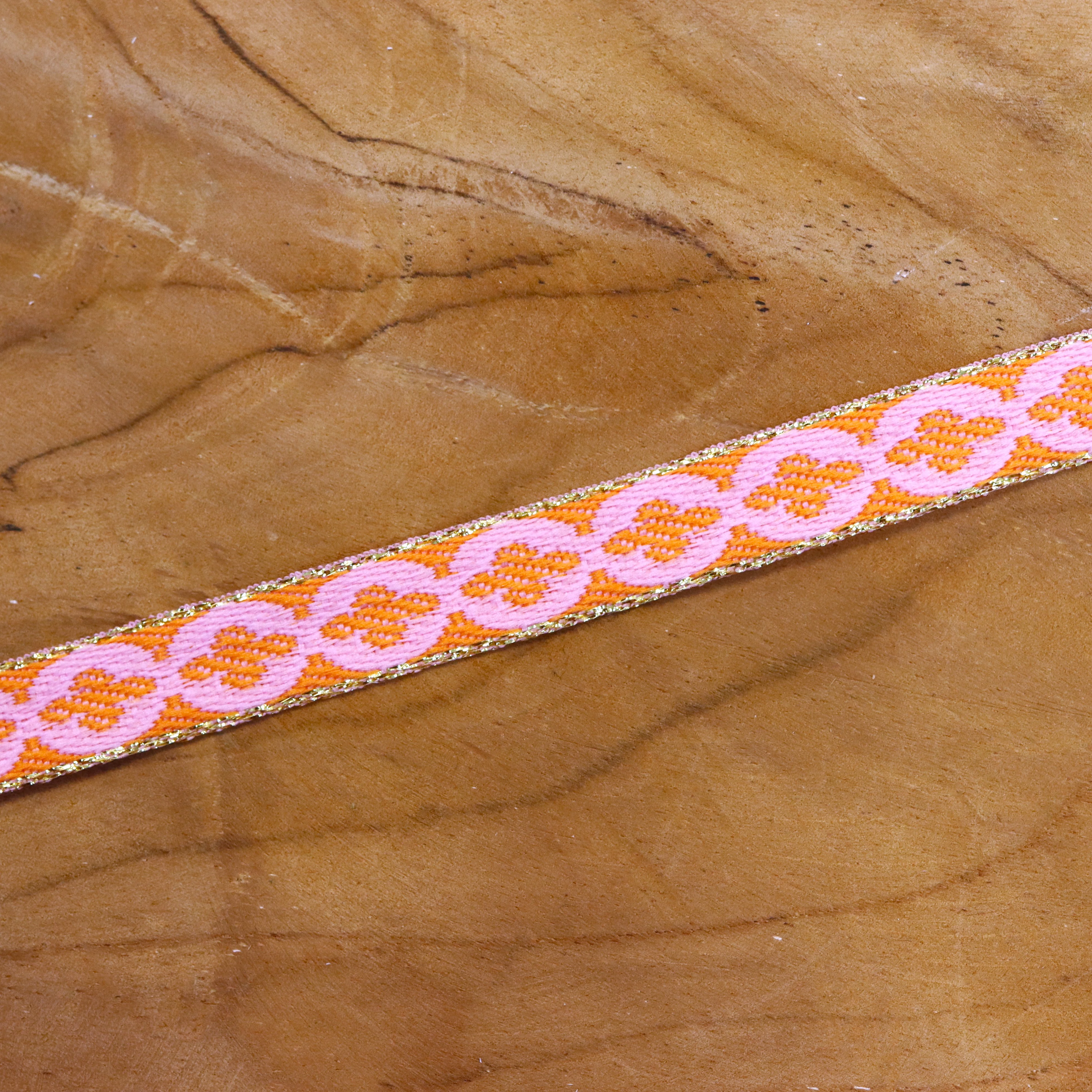 Lint bloem oranje-roze met gouden rand