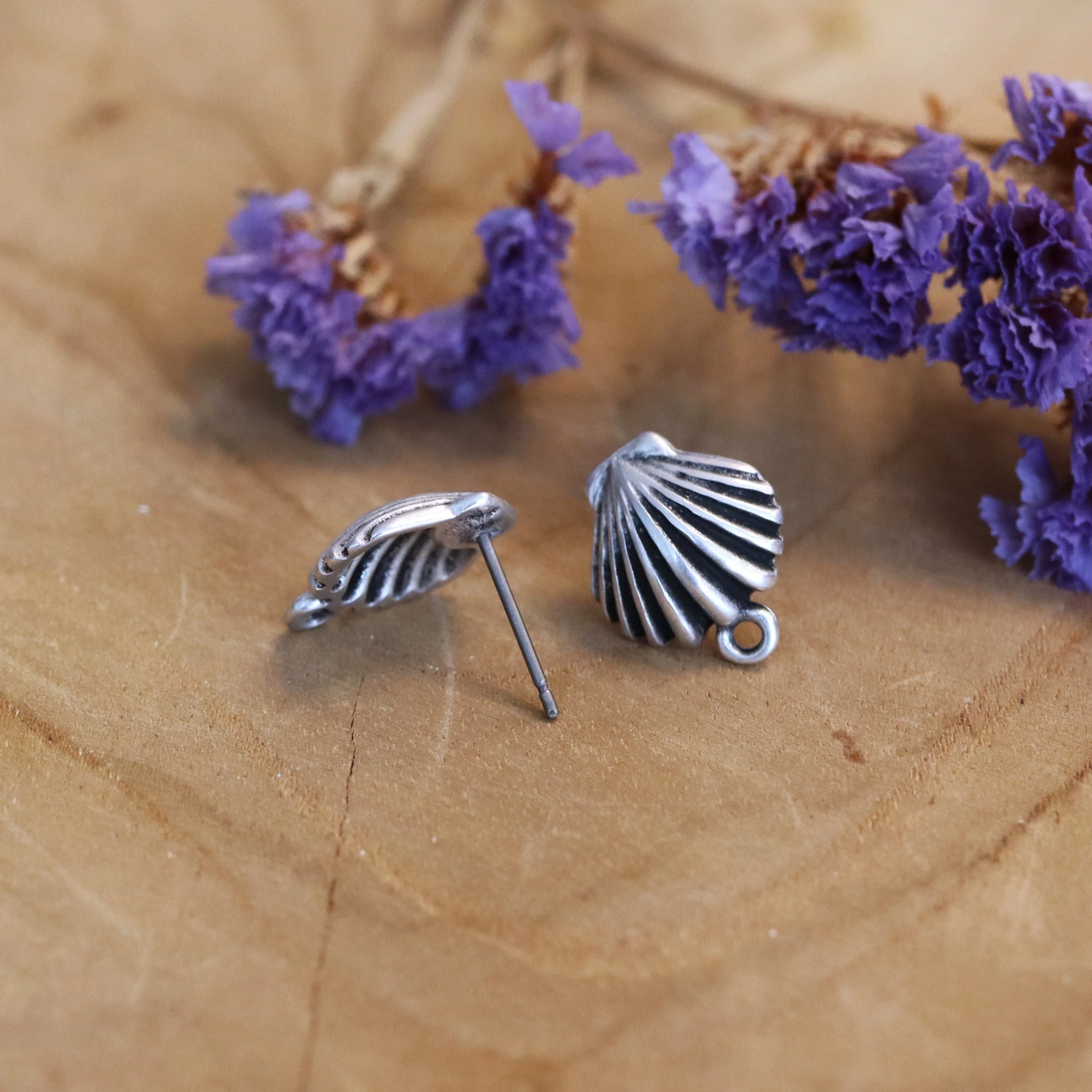 Oorsteker DQ zilver schelp met oogje