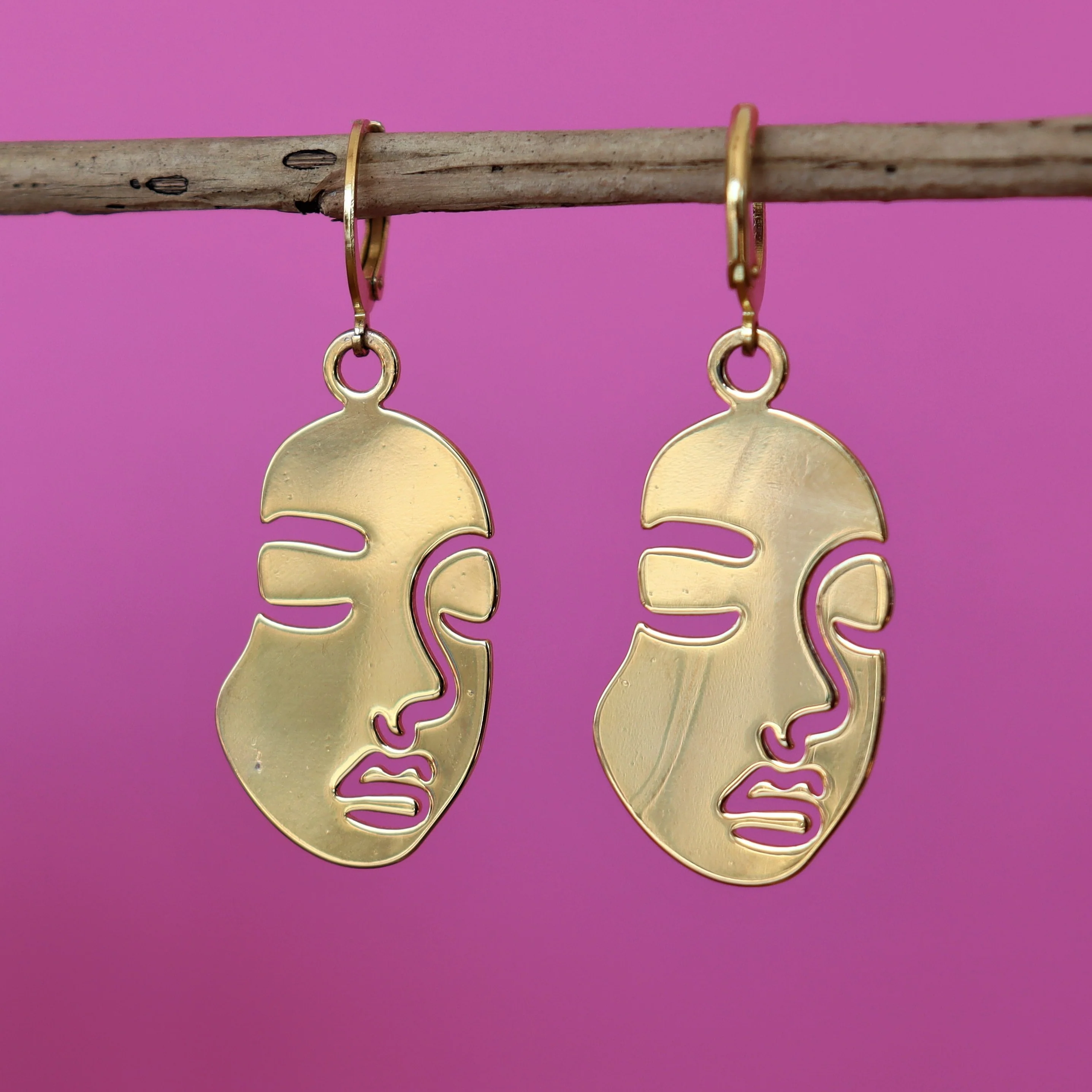 Stainless steel oorbellen met gezicht goud